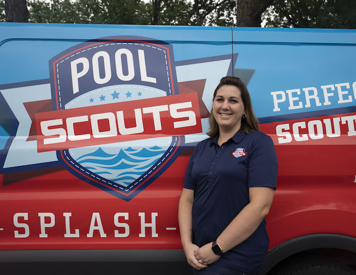 Pool Scouts of Cape Coral owner Kate in front of a Pool Scouts van