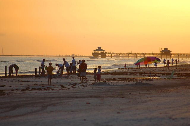 People on the beach at sunset in Fort Myers