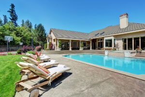 Image of house and beautiful backyard with in-ground pool