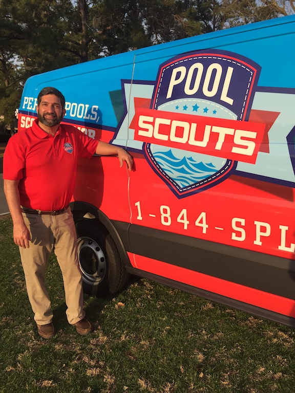 Pool Scout owner leaning against Pool Scouts van that is parked outside
