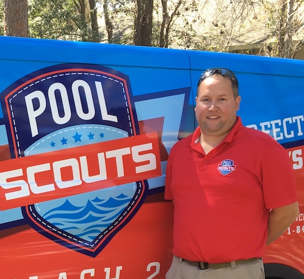 Lead technician Frank Duda standing in front of Pool Scouts van and smiling