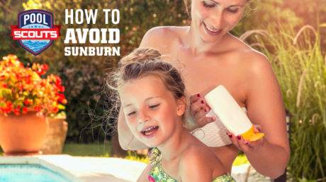 Mom putting sunscreen on her daughter near the pool