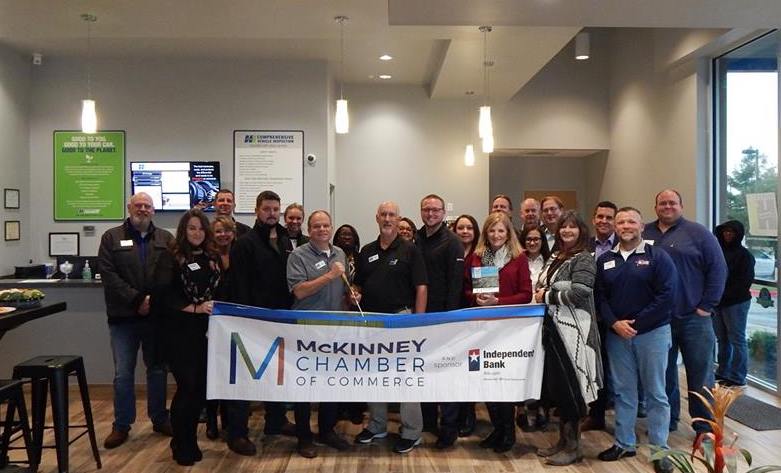 The McKinney Chamber of Commerce performing a ribbon cutting ceremony