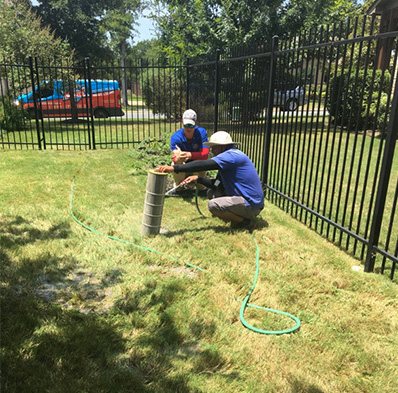 Pool techs cleaning a pool filter