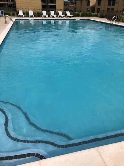 Clear blue pool after a pool cleaning treatment