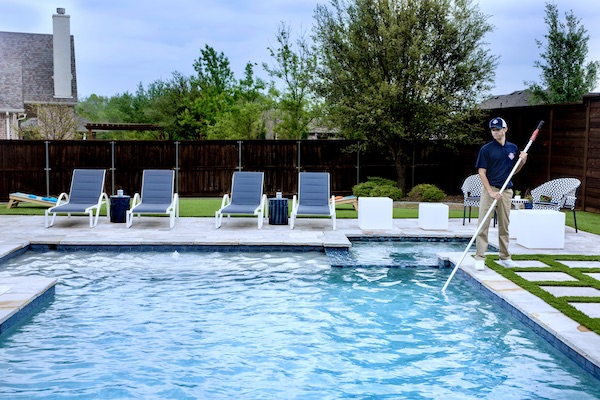 Pool Scouts technician providing pool maintenance to customer's pool