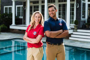 Pool Scouts service technicians standing in front of pool