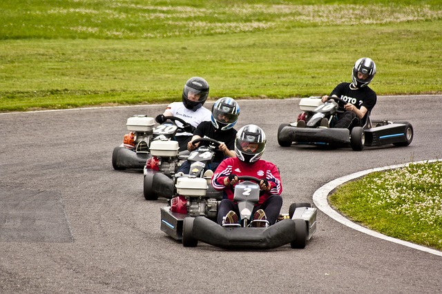 Group of friends go-karting on a track outside