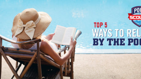 Woman reading book by the pool