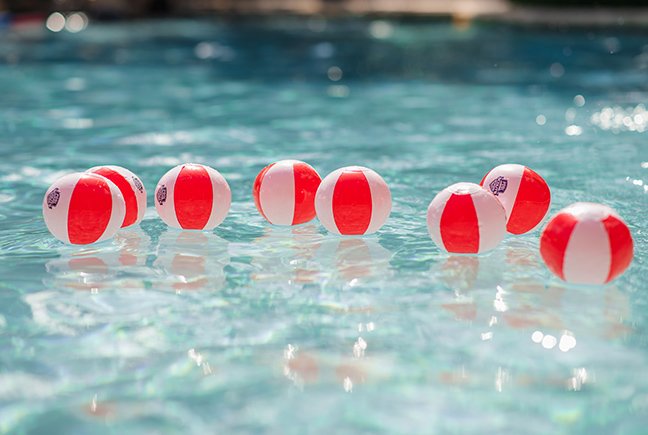 Pool Scouts beach balls floating in clean pool