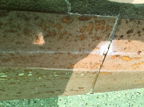 Corrosion buildup on the edge of a pool