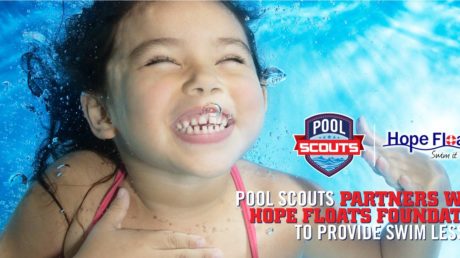 Girl smiling while swimming in the pool