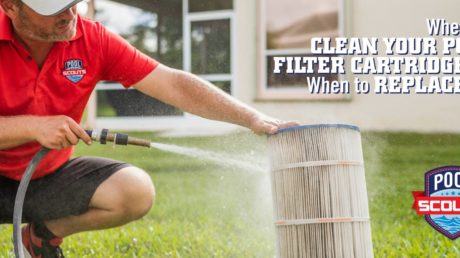 Pool technician spraying off pool filter cartridge