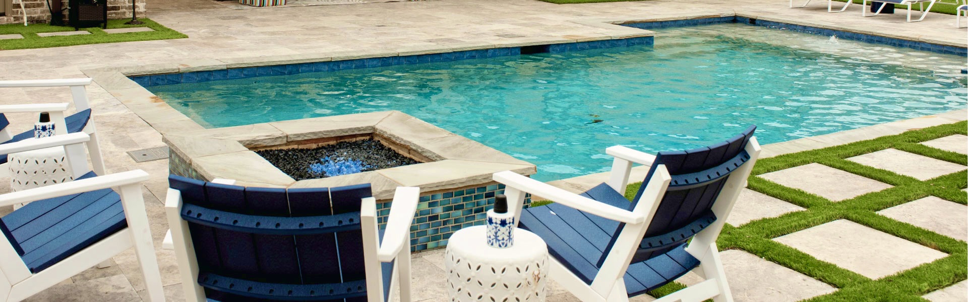 Sitting area in backyard by clean pool