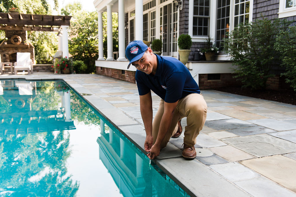 Pool Scouts technician testing the pool water chemical levels as part of pool service