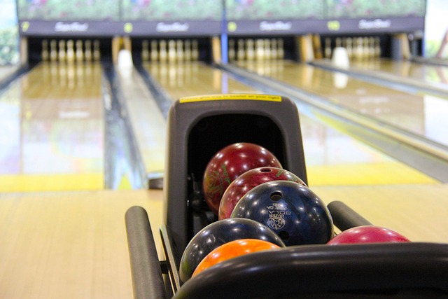Bowling alley with bowling balls lined up 