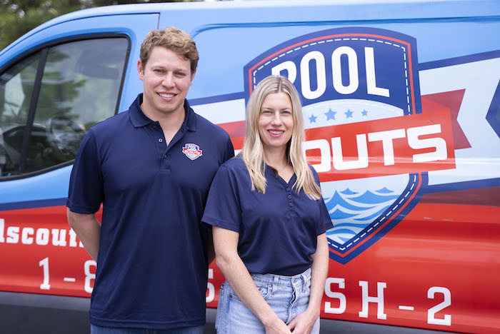 Pool Scouts owners smiling in front of Pool Scouts van