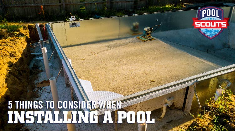Pool being installed in a backyard
