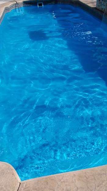 Bright clean pool after Pool Scouts green pool service treatment