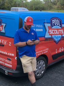 Pool Scouts technician David sending out a customer update on his phone