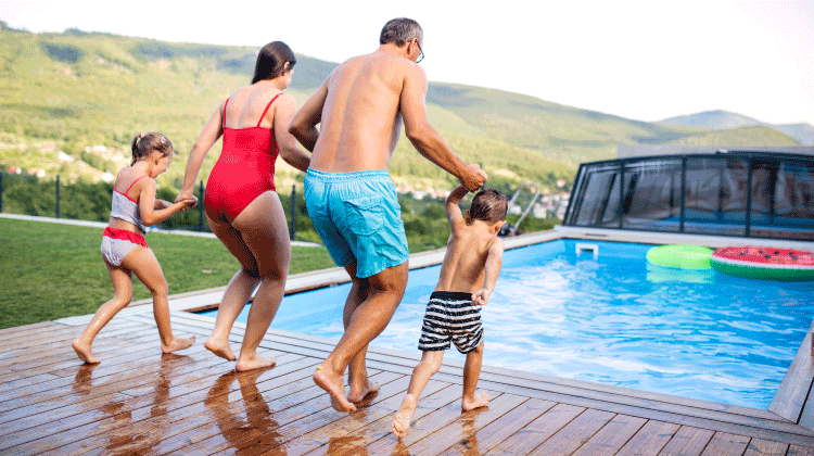 Family jumping into pool