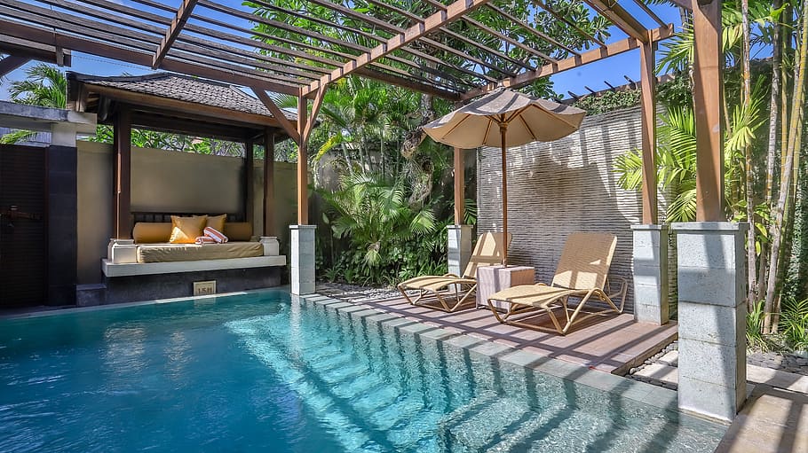 Clean swimming pool in a beautiful, bright backyard