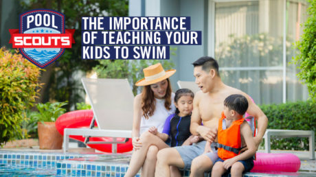 Family sitting along edge of pool talking about water safety