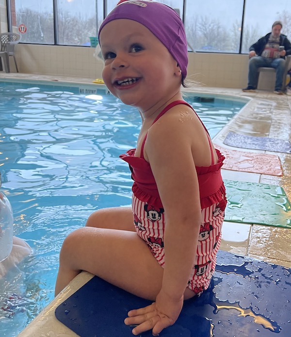 Little girl smiling during swim lessons